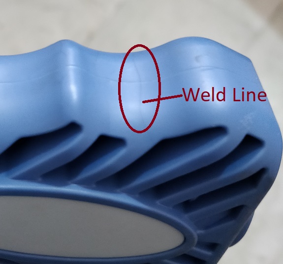 Weld Lines appears in the same section of injection molded part, where flow of molten plastics meets with each other.