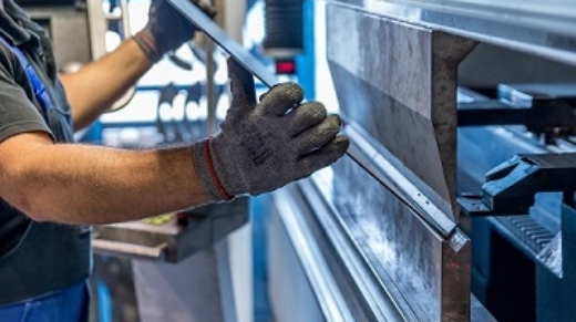 Operator bending sheet metal part using press bending Machine